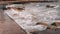 Close up view of promenade. Close up view of waves and stones. Sea promenade at bad stormy weather. Waves hitting city promenade.