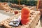 Close up view of protective hard hats that laying down on the bricks