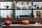 close up view of pumpkins on wooden tabletop and hanging flags with happy halloween inscription