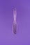close up view of purple hairbrush