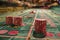 Close up View of Red Dice and Chips on Casino Table with Blurred Lights and Gaming Action in the Background