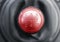 Close up view of a red gear lever shift, overhead view manual gearbox, car interior details.