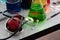 Close up view revealed a stethoscope resting beside an array of meticulously arranged chemistry equipment on a pristine white