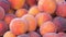 Close up view of ripe beautiful large fresh pink peaches fruits on a street market counter or a vegetable store in