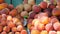Close up view of ripe beautiful large fresh pink peaches fruits on a street market counter or a vegetable store in