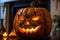 Close up view of scary Halloween pumpkin with eyes glowing inside