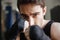 Close up view of serious boxer doing exercise in gym