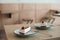 close up view of served peaces of cake on plates on wooden tabletop