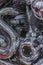 Close up view of a shiny motorcycle engine. vintage close up of motorcycle exhaust, noise. vertical photo