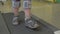 Close up view of small boy feet on treadmill in the special orthopedic bandage and foot wear