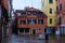 Close-up view of small town square with ancient colorful buildings in Venice, Italy. Quiet street without crowd of tourists.