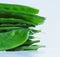 Close up view of a stack of fresh snow peas