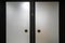 Close up view of steel door handles on glass doors isolated