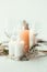 close up view of stylish table setting with candles, wineglasses and flowers