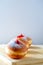 Close up view of tasty Jelly Doughnuts with jam on wood background. Hanukkah celebration concept.