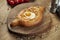 Close up view on tasty traditional Adjarian Khachapuri - open baked pie with melted salt cheese suluguni and egg yolk on wooden