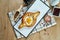 Close up view on tasty traditional Adjarian Khachapuri - open baked pie with melted salt cheese suluguni and egg yolk on wooden