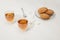 close-up view of tea in glass cups, spoon, sugar cubes and oatmeal cookies on plate