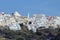 Close up view of Thira with white houses and church - Town in Sa