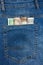Close Up View to Euro, Dollar, Koruna, Forint Banknotes Sticking Out From a Blue Jeans Pocket