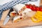 Close up view on traditional Arab shawarma, shaurma or kebab on board stands on white background. Freh doner with ingridients,