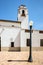 Close up view of a train depot clock tower and lightpole