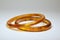 Close up view of two vintage bakelite bangle bracelets on white background