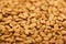 Close up view of uncooked bulgur grains.