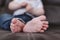 Close up view of unrecognizable baby feet. Home, indoors and family concept