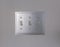 Close up view of vertical flip toggle light switches in off mode