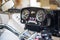 Close up view view over the handlebars of motorcycle, speedometer. Steering wheel, speedometer, tachometer, rearview mirror and