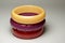 Close up view of vintage bakelite bangle bracelets on white background