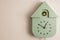 Close up view of wall cuckoo clock on  background.