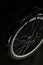 close-up view of wheel of classic bicycle isolated on black