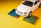 Close up view of a white toy car on top of a microprocessor . Selective focus