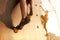 Close up view of woman feet in climbing shoes on artificial rock wall on sunset. Two active sporty women compete on