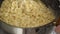 Close up view of woman hands cooking carbonara pasta