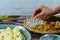 Close-up view, woman hands taking some oriental sweets, Samarkand, Uzbekistan