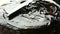 Close up view. Woman spreading a hocolate glaze on a sponge cake. Female hand pour cream with a knife on the cake and