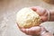 Close Up View Of women Kneading yeast Dough