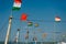 Close-up view of the wooden masts of fishing boats in bay, Goa, India. On the old masts fluttering Indian flags