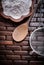 Close up view of wooden spoon bowl flower sieve egg-whisk