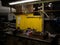 Close-up view of a workbench, featuring a variety of mechanical tools and equipment