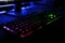 Close up view of workplace with led rainbow backlight gaming key