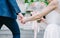 Close up view of young bride and groom holding hands sceen outdoor