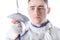 Close-up view of young man professional fencer holding rapier