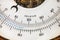 Close up of a vintage circular thermometer