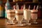 close-up of vintage milkshake glasses with striped straws
