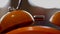 Close up of a vintage red bell clock on blurred background of a room. Stock footage. Interior details, loud retro alarm