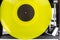 Close up of vintage turntable record player with yellow vinyl